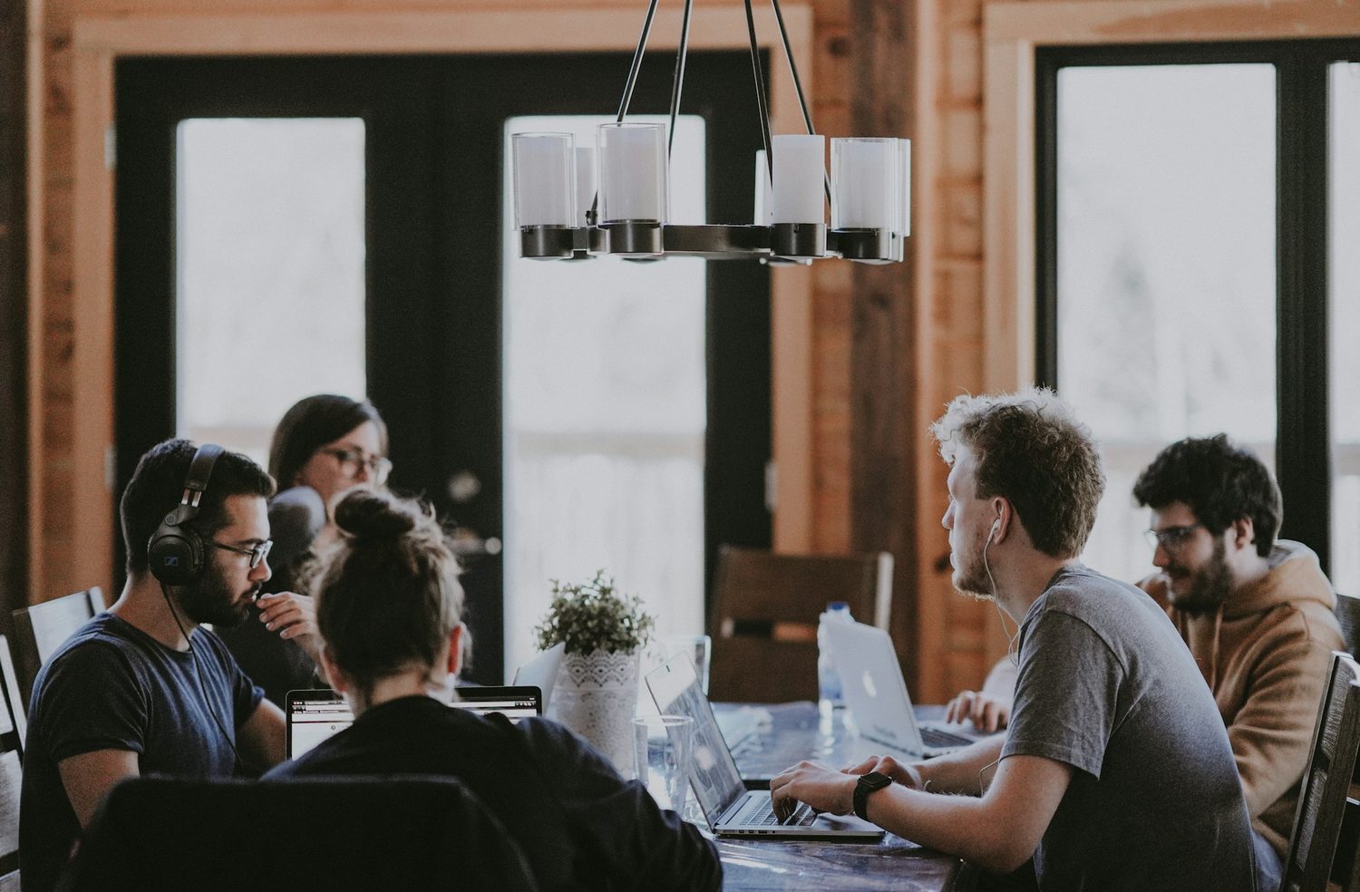 Ujamii team members collaborating at a work session, reflecting the company's founding story